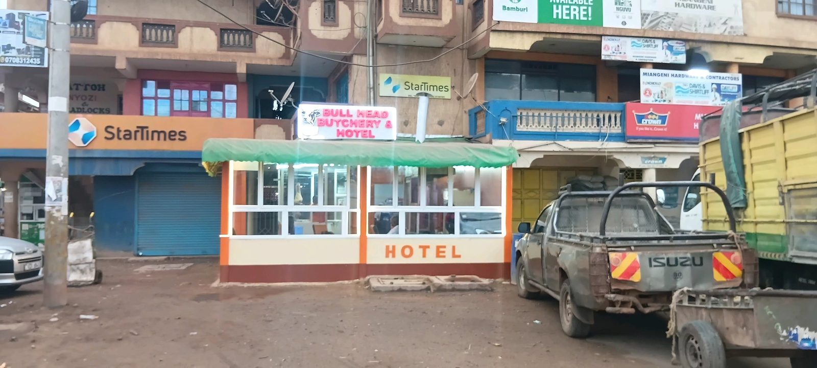 Trucks parked outside Bullhead in Emali town
